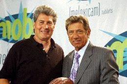 Tommy Cheatham pictured with former NFL quarterback Joe Namath on location during a production
